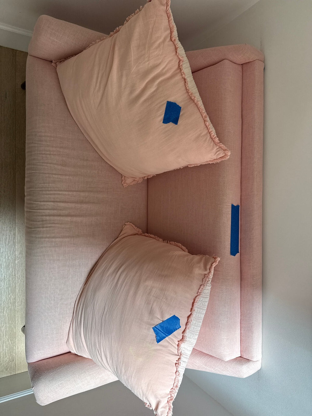 Blush Pink Linen Loveseat with Ruffled Pillows